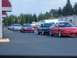 1994 Ford Probe - A red 1994 Ford Probe is seen in a line of vehicles, possibly at an event or gathering.