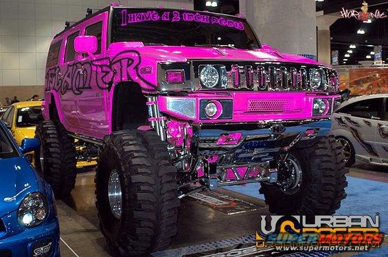 Pink lifted Hummer H2 with custom text on windshield and side