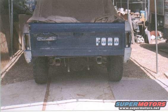 Rear view of a Ford truck with dual exhaust pipes