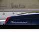 2002 Ford Thunderbird - Side view of a dark blue Thunderbird convertible, with the Neiman Marcus logo visible in the background.