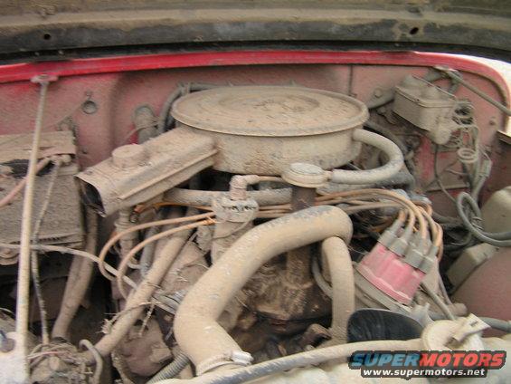 Engine bay with air cleaner and distributor cap