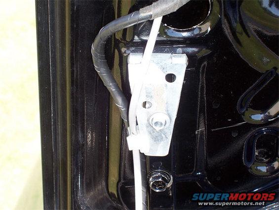 Trunk latch mechanism with wiring and hinge