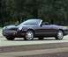 2002 Ford Thunderbird - A dark-colored 2002 Ford Thunderbird convertible is shown from the front three-quarter view.