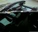 2002 Ford Thunderbird - The interior of a 2002 Ford Thunderbird convertible is visible from a side angle with the soft top up.