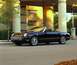 2002 Ford Thunderbird - A black 2002 Ford Thunderbird convertible is parked in front of a building with a Neiman Marcus sign.