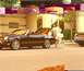 2002 Ford Thunderbird - A woman stands by a black 2002 Ford Thunderbird convertible parked in front of a building.