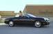 2002 Ford Thunderbird - A black 2002 Ford Thunderbird convertible is shown parked in front of a Neiman Marcus store.