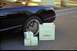 2002 Ford Thunderbird - Neiman Marcus shopping bag and gift boxes next to a 2002 Ford Thunderbird.
