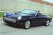 2002 Ford Thunderbird - Black 2002 Ford Thunderbird convertible driving on a road with a driver.