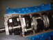 1969 Ford Mustang - Close-up view of an engine block's internal components, including the crankshaft and connecting rods.