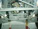 1984 Ford Bronco - Vehicle chassis and engine components are visible, supported by jack stands.