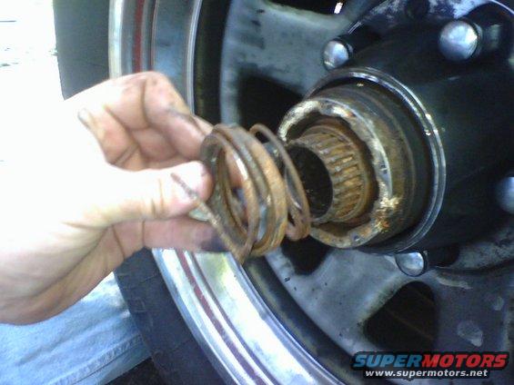 c3.jpg Upon examination of the Auto hub I found that the spring was broken.  I removed lockring to detach the spring assembly from the hub.   