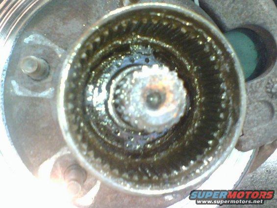 next I removed the bearing washer.  the many holes in the washer are for the pin in the bearing adjusting nut.   Upon removal of the bearing adjusting nut I had found the pin to be sheared off.  