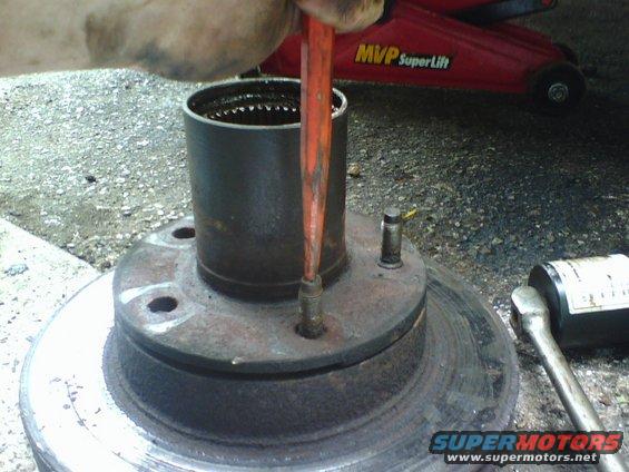 k3.jpg I had removed the disc brake caliper pins and removed the caliper from the rotor. removed the rotor/hub assembly.   I punched out the lug studs with a cold chisel.