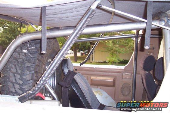 Interior view of a vehicle showing a roll cage, spare tire, and seats. Date stamp reads 09/15/2007