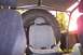 1989 Ford Bronco - The interior of a vehicle shows a roll cage, a large spare tire, and seats, with a watermark visible.