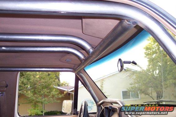 Interior view of a vehicle's roll cage and windshield