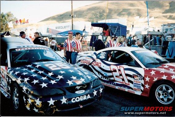 1995 Ford Mustang race cars with stars and stripes livery, one numbered 25, the other 21