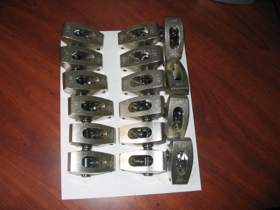 Set of 16 metal rocker arms with '1.6F' stamped on them