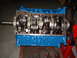 1969 Ford Mustang - This is a close-up view of an engine block assembly, showing the crankshaft and connecting rods.