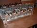 1972 Ford Ranchero - Close-up view of an aluminum engine cylinder head, its intricate design and polished valve seats.