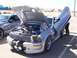 2002 Ford Mustang - This modified Ford Mustang features custom lambo doors and a teddy bear perched in the engine bay.