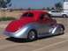2002 Ford Mustang - Custom hot rod coupe with flames and a 'DANS 37' license plate parked outdoors.