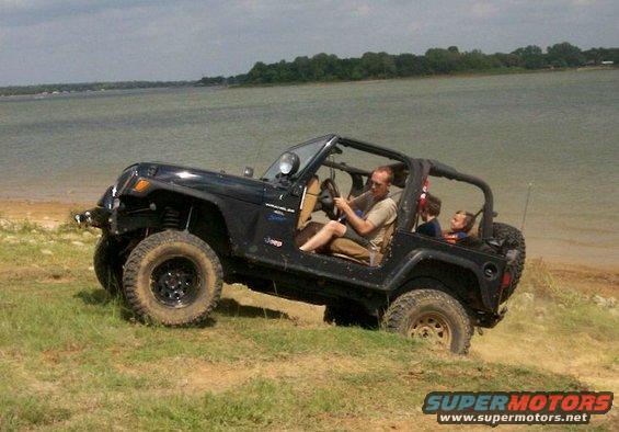 jeep-cresting-the-berm.jpg Jeep cresting berm