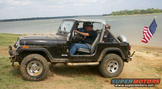 jeep-with-flag-up--over-berm.jpg Jeep with flag up and over berm