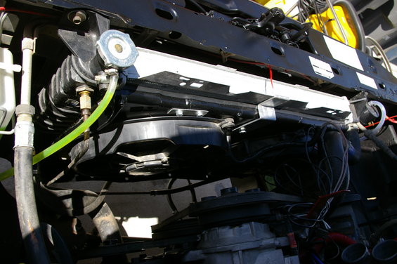 Radiator, fan, and coolant hoses visible in engine bay