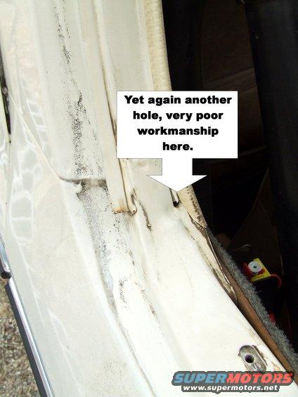 Interior door jamb with rust and damage, text overlay points out poor workmanship