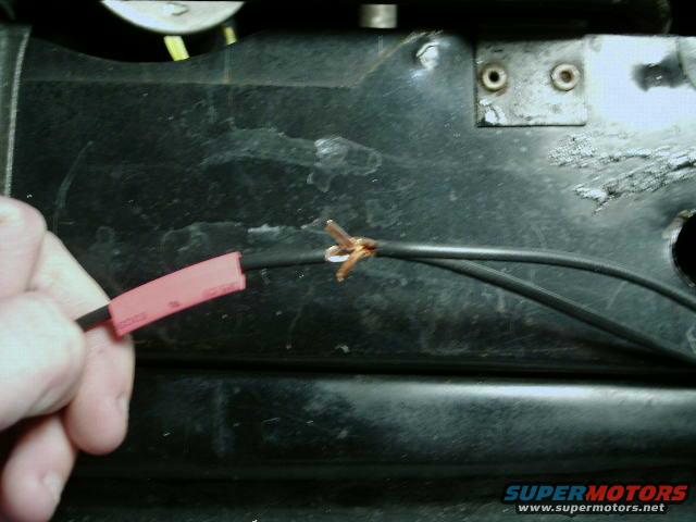 Don't forget to have the heatshrink ready and insert the wire through the hole.