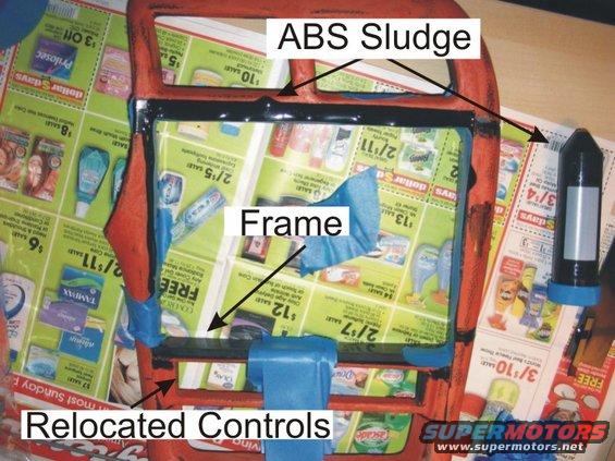 Dashboard frame with ABS sludge and relocated controls, covered in newspaper ads
