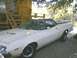 1972 Ford Ranchero - This 1972 Ford Ranchero is parked in a shaded area next to a building with a wooden staircase.