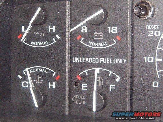 lfl_off.jpg When off, the black marker on the surface helps it blend with the gauge face.  It could have been positioned inside the fuel pump icon below the gauge scale.
IF THE IMAGE IS TOO SMALL, click it.

[url=http://www.supermotors.net/registry/media/760981][img]http://www.supermotors.net/getfile/760981/thumbnail/clusterbezel9296.jpg[/img][/url]