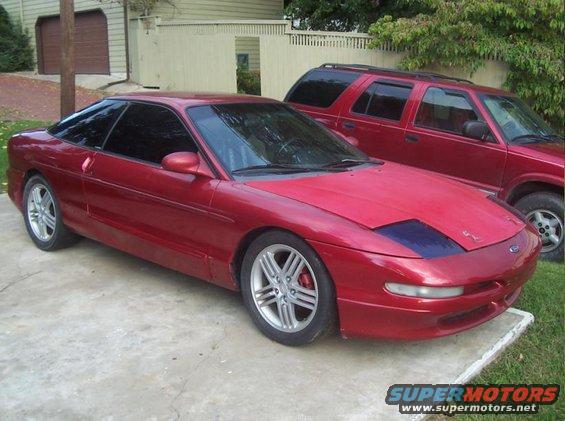 Red 1995 Ford Probe coupe, 3/4 front view