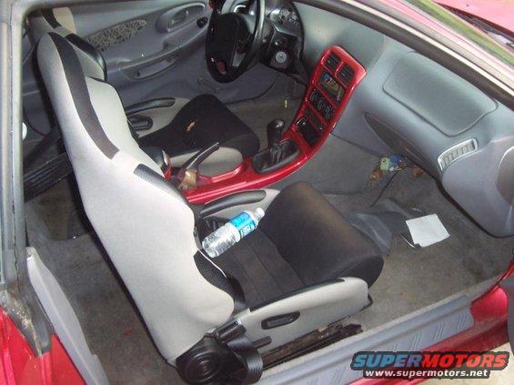 Interior of a 1995 Ford Probe showing front seats, dashboard, and center console