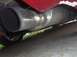 1995 Ford Probe - Close-up view of a vehicle's exhaust system, showing a large, shiny muffler and pipe.
