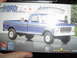 1989 Ford Bronco - Box art for a blue Ford pickup truck model kit, a dog in the bed and a man washing the hood.