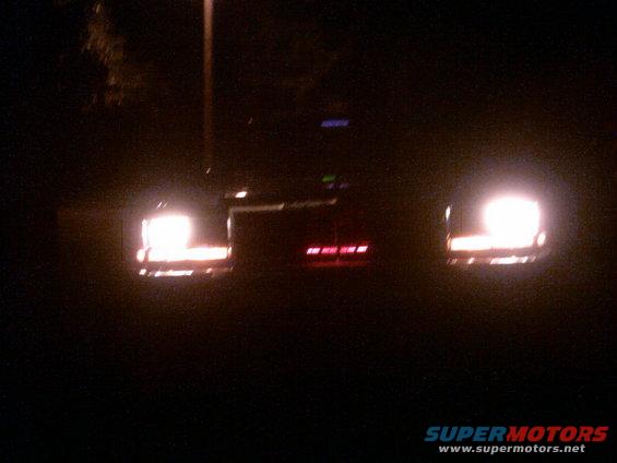 1985 Ford Crown Victoria LTD rear with taillights illuminated at night