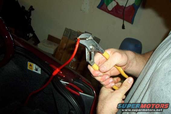 clamps.jpg Use big vice grips or pliers to clamp the connectors on the wires, then put a wrap of duct or electrical tape around the end of the insulation to the connector before putting the rubber sheath over it.