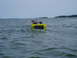 1978 Ford F-250 - A yellow boat with multiple outboard motors travels across the water.