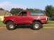 1989 Ford Bronco - bright red look w/ lift