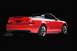 2003 Ford Mustang - This red 2003 Ford SVT Mustang convertible is shown from the rear three-quarter angle against a black background.