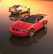 2003 Ford Mustang - Two Ford Mustangs, a red convertible and a silver coupe, are shown on a reflective surface at sunset.