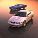 2003 Ford Mustang - A silver 2003 Ford Mustang is shown alongside a blue 1969 Ford Mustang, highlighting the evolution of the iconic muscle car.