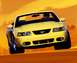2003 Ford Mustang - A yellow 2003 Ford Mustang convertible is shown from the front, driving against an orange background.