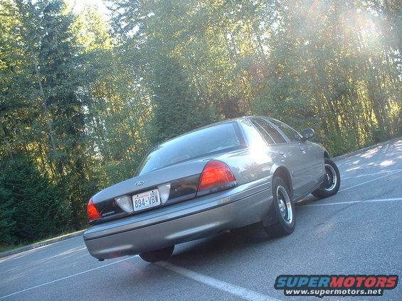 Rear view of a gray 2000 Ford Crown Victoria with a license plate reading 894-VBW