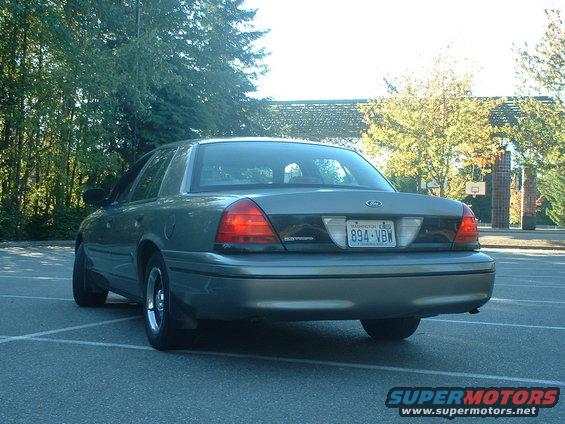 Rear view of a 2000 Ford Crown Victoria parked in a lot. Washington license plate 894-VBW is visible