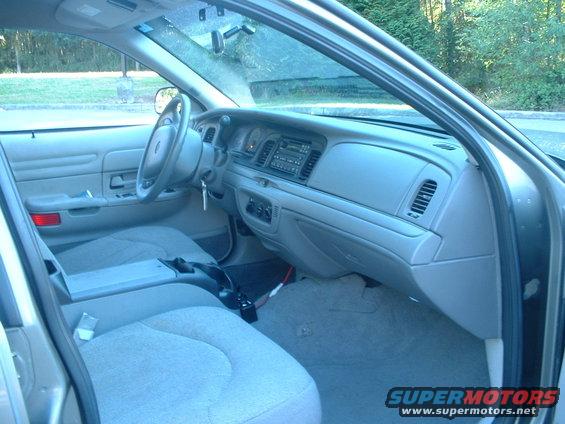 Interior of a 2000 Ford Crown Victoria, showing the dashboard, steering wheel, and front seats